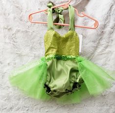 Tinker Bell sequin tutu Romper Custom orders welcomed Care instructions: Handwash cold water, hang to dry Fitted Glitter Tulle Tutu Dress For Summer, Green Tutu Dress For Summer Parties, Summer Dress-up Glitter Tulle Tutu Dress, Green Summer Party Tutu Dress, Summer Glitter Tulle Tutu Dress For Dress-up, Fitted Tutu Dress For Summer Costume, Fitted Summer Costume Tutu Dress, Fitted Tutu Dress For Summer Festivities, Fitted Tutu Dress With Sequins For Summer