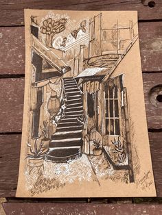 a drawing of a house with stairs and potted plants next to it on a piece of cardboard