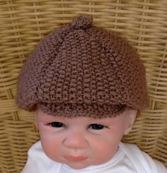 a close up of a baby wearing a knitted hat