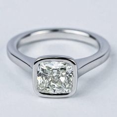 a cushion cut diamond in a white gold ring