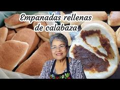 a woman standing in front of breads with the words empanadas rellenas de calabza