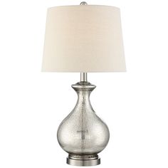 a silver table lamp with a white shade