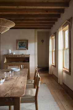 a wooden table sitting in the middle of a room