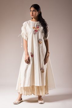 Shop for these amazing collections of Ivory Silk Chanderi Embroidered Floral Round Dress With Inner For Women by Prama by Pratima Pandey online at Aza Fashions. Beige Raw Silk Dress With Resham Embroidery, Designer Cotton Dress With Resham Embroidery, Cotton Dress With Resham Embroidery For Designer Wear, Cream Embroidered Raw Silk Dress, Cotton Dresses With Floral Embroidery For Navratri, Designer Raw Silk Off-white Dress, Traditional Beige Raw Silk Dress, Traditional White Dress With Back Tassel Tie-up, Festive Cotton Embroidered Dress With Resham Embroidery