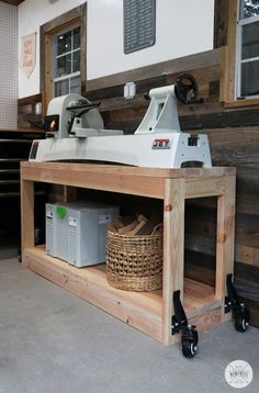 a machine that is sitting on top of a wooden shelf in a room with wood planks