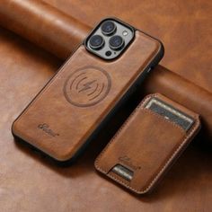 an iphone case sitting on top of a brown leather couch next to a cell phone