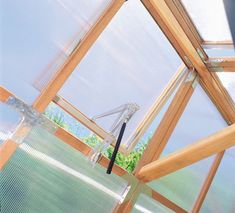 the inside of a greenhouse with glass walls