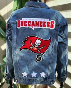 Custom made to order ONE OF A KIND team jackets. Listing includes, LADIES 1 denim jacket (Levi's 90's Trucker Jacket) personalized with your choice of, 1 Back Name Chenille PATCH 1 Front name (embroidered) PATCH 1 Mascot PATCH up to 10inches 3 embroidered stars Official NBA, MLB, NFL, etc. sleeve patch PATCH GENTS 1 denim jacket (Levi's Men's Original Trucker Jacket) personalized with your choice of, 1 Back Name Chenille PATCH 1 Front name (embroidered) PATCH 1 Mascot  PATCH up to 10inches. 3 em Rhinestone Jacket, Personalized Gift Ideas, Embroidered Stars, Chenille Patch, Team Jackets, Gift Ideas Christmas, Football Jackets, Custom Fans, Denim Diy