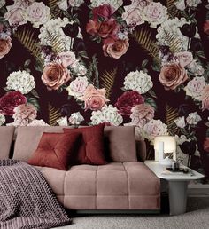 a living room with floral wallpaper and couch