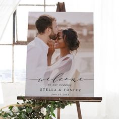 an easel with a wedding photo on it