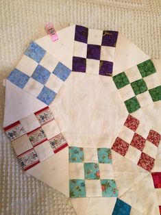 the quilts are laid out on top of each other