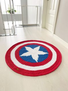 the captain's shield rug is on the floor in front of an open door