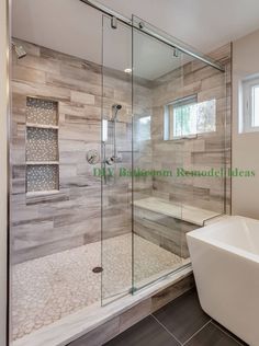 a white tub sitting next to a walk in shower