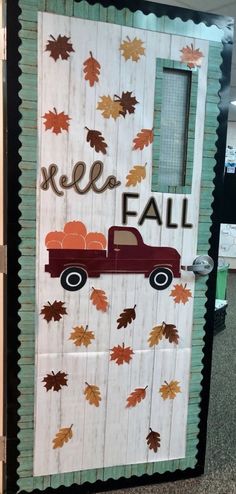 a door decorated to look like a truck with leaves on it and the words hello fall