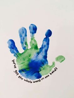 a hand print that says, you're the whole world in my hands with blue and green colors