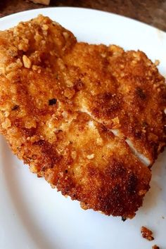 a piece of fried chicken on a white plate