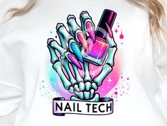 a woman wearing a white nail tech t - shirt