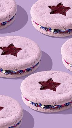 six cookies with red, white and blue sprinkles are arranged in the shape of a star