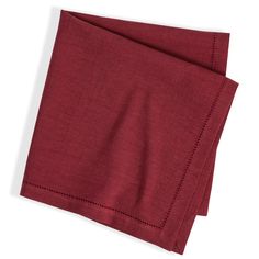 the red linen is folded up and ready to be used as a tablecloth or napkin