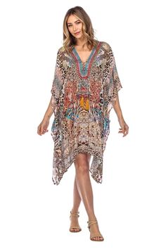 Lightweight Viscose Silk with colorful digital print and decorative rhinestones. Care: Hand wash cold, hang dry, iron from reverse if needed. The perfect La Moda Kaftan Resort Wear top, flowy and super light. It will keep you fresh and looking beautiful in warm weather! Wear it over swimsuit or as regular top. Made with lightweight material, roomy with a relax fit. This caftan top features a deep lace up V neck, generous armholes and fine embellishing.It has an elegant cape like drape. Its uniqu Multicolor V-neck Swimwear For Festival, V-neck Summer Kaftan For Parties, Summer Party Kaftan In Free Size, Multicolor V-neck Party Swimwear, Multicolor V-neck Swimwear For Party, Summer Party Kaftan, Free Size, Fitted V-neck Kaftan For Festivals, Multicolor Digital Print Dress For The Beach, Multicolor Digital Print Beach Dress