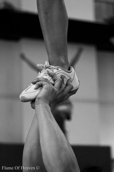 two people doing handstand on top of each other