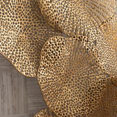 an animal print fabric with gold spots on it