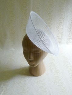 "One hat base with a 3.75\" tall upturned brim made in white stiffened sinamay straw that measures approximately 11\" (27.94 cm) in diameter at the top. The base is contoured to fit against the head. The edges of the brim are finished in sinamay. The multi-layer stiffened sinamay straw has a very delicate look but it has a great sturdy weave and provides excellent support for your millinery creations. This is NOT a finished hat and will not stay on your head unless you add a head band to wear. A Making Hats, Blank Hats, Millinery Supplies, Hat Base, Classic Hats, Diy Hat, Doll Hat, White Hat, Fascinator Hats