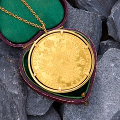 This jaw-dropping pendant features a large gold Austrian 4 Ducat coin from 1915 mounted into a 14k gold setting. One side of the coin depicts a profile portrait of Franz Joseph I, while the other depicts the Austrian double eagle crest, both impeccably rendered. The coin is crafted in 22k gold, is mounted into a 14k gold bezel, and comes complete with a 14k yellow gold 20 inch cable chain. Victorian Necklace With Coin Pendant For Formal Occasions, Formal Coin Pendant Necklace, Luxury Engraved Coin Necklace, Heirloom Coin Necklace Collectible, Hallmarked Yellow Gold Coin Necklace, Luxury Yellow Gold Medallion Coin Necklace, Luxury Yellow Gold Coin Pendant Necklace, Engraved Yellow Gold Coin Necklace Collectible, Collectible Engraved Yellow Gold Coin Necklace