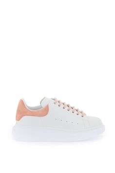 Alexander McQueen leather sneakers with oversized rubber sole and leather lining with removable insole. Silver-tone lettering logo print on the tongue and on the contrasting suede heel tab, lace-up closure and side perforations. Spare laces included. Luxury Leather Sneakers With Logo-print Tongue, Luxury Casual Sneakers With Logo Print, Luxury Modern Sneakers With Removable Insole, Luxury Lace-up Sneakers With Logo-print Tongue, Luxury Leather Lace-up Shoes With White Sole, Luxury Silver Sporty Sneakers, Luxury White Lace-up Leather Shoes, Luxury Modern Sneakers With Perforations, Luxury Sporty Sneakers With Logo