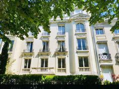 an apartment building with many windows and balconies