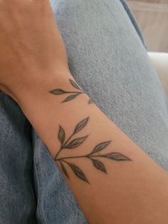 a person with a tattoo on their arm