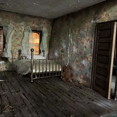 an abandoned bedroom with a bed and window