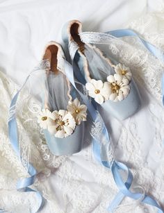 A pair of beautiful, pastel-colored, shabby chic pointe shoes hand-dyed in light blue and decorated with white and golden flowers. Double satin and lace ribbons attached to add a special accent to these charming , vintage looking ballet shoes. Tulle inserts included. These pointe shoes were danced, loved and now have been given a new life, and hopefully will find a new home soon! They could be a lovely gift to any ballet lover or a beautiful piece of decor. Original brand: Bloch. Total length of Blue Ballet Shoes, Point Shoes, Pointe Shoes, Lace Ribbon, Blue Bow, Ballet Flat Shoes, Something Blue, Pastel Colors, Lovely Gift