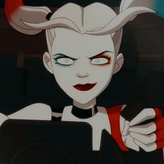 a cartoon character with horns on her head holding a tablet