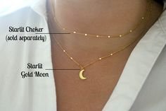 A rich golden moon has been set on dainty twinkling gold chains to create this gorgeous enchanting necklace, perfectly suited for layering. The 7x12mm 24k gold plated moon charm rests on 1.7mm 24k gold plated chains interspersed with tiny twinkling gold bars. This necklace is finished with a 24k gold plated lobster claw clasp. This necklace is shown paired with a matching starlit gold choker necklace. You can find that necklace sold separately here: https://www.etsy.com/listing/664002306/starlit Elegant Layered Necklace With Moon Charm As Gift, Gold Crescent Moon Necklace, Moon And Stars Necklace, Moon Necklace Gold, Crescent Moon Necklace Gold, Stars Necklace, Gold Crescent Moon, Star And Moon Necklace, Gold Moon Necklace