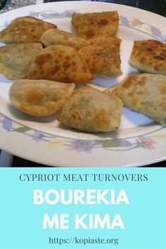 some food is sitting on a plate with the words, crypt meat turnoverers boureka me kima