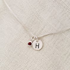 "January Birthstone Initial Necklace, Garnet Jewelry, January Birthday Gift, January Birthstone Jewelry,Personalized, Sterling Silver Garnet Lovely January Birthstone Garnet Necklace. For babies born in January, the garnet is the perfect gem to represent their birthstone. This beautiful stone, which is most commonly red but can be found in a range of other colors, symbolizes peace, prosperity and good health. Some say it even has the power to give the wearer eternal happiness, health and wealth. Red Birthstone Necklace For Valentine's Day, Personalized Red Jewelry For Birthday Gift, Valentine's Day Birthday Birthstone Necklace, Round Birthstone Necklace With Charms For Birthday, Red Birthstone Jewelry For Birthday Gift, Red Charms Jewelry For Birthday, Charm Birthstone Necklace For Birthday Gift, Round Charms Birthstone Necklace Birthday Gift, Round Charm Birthstone Necklace For Birthday Gifts