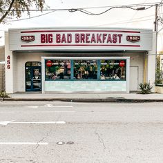 a big bad breakfast store sitting on the side of a road