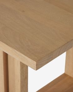 a close up of a wooden table with no one on it's legs or feet