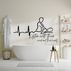 a bathroom with a bathtub and wall decal