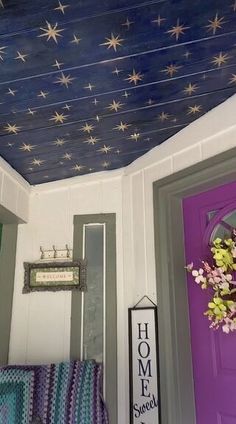 the ceiling is painted purple and has stars on it