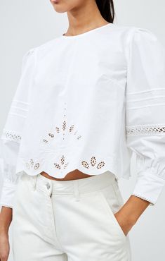 Alissa Broiderie Top Final sale | Not eligible for return or exchange Excluded from further discounts Elevate your summer wardrobe with our Alissa Broderie Top. Made from crisp cotton, this essential piece features delicate broderie detailing, a feminine scallop hem, and vivacious puff sleeves. Complete the look with a playful keyhole fastened back for an elegant touch. Luxury Spring Tops With Scalloped Edges, Luxury Cotton Tops With Smocked Bodice, Luxury Summer Blouse With Smocked Cuffs, Luxury Smocked Back Blouse For Spring, Luxury Summer Blouse With Placket, Luxury Summer Blouse With Embroidered Neckline, Cutwork Top, Restyle Clothes, Alissa White