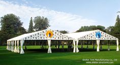 tents set up in the middle of a grassy field