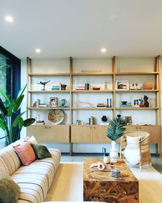 a living room filled with furniture and a large window