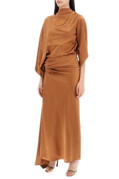 The Christopher Esber midi dress is made of pure silk satin, featuring a draped cape design with an asymmetrical hem and a deep back neckline. It has a hidden zip closure on the side and a relaxed fit with a fitted waist. The model is 177 cm tall and wears a UK size 6.Gender: WomenMaterial: 100% SILKColor: BROWNMade in: IMPORTEDProduct ID: 24013418 GNGR*Import tax/duty will be calculated at checkout (If applicable) Draped Midi Dress, Cape Designs, Draped Midi Dresses, Christopher Esber, Asymmetrical Hem, Womens Midi Dresses, Swimwear Tops, Silk Satin, Pure Silk