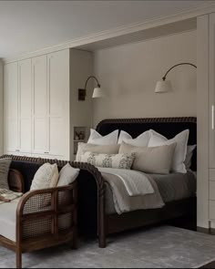 a large bed sitting next to a window in a bedroom