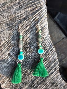 These earrings are made with jade, moss green agate, green jasper, green glass beads and green silk tassels. Clip On Tassel Earrings, Green Tassel Earrings, Silk Tassels, Brass Hoop Earrings, Green Jasper, Green Stones, Emerald Bead, Chic Earrings, Tassel Jewelry