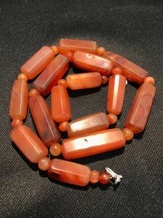 A beautiful 900 years old Pre Ankur carnelian beads necklace from Cambodia, worn by royals at that time as a luck charm. agate beads as counters. In great condition and colors of the beads are exceptional with great shine on its surface as its been continuesly used since then till now. Carnelian Gemstone Beads For Jewelry Making, Ancient Beads, Short Necklaces, Gallery Jewelry, Rare Beads, Carnelian Agate, Carnelian Necklace, Crystal Bead Necklace, Carnelian Beads