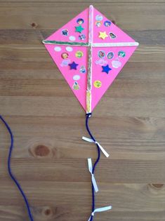 a kite that is on top of a wooden table