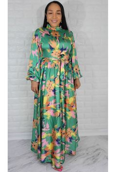 Material: Satin Style: Maxi Dress Long Sleeve Color: Green & Mul Fit True to size. The model is wearing a size Small with 36 Bust Size Recommended Small = 4/6 Medium= 8 Large= 10 XL = 12 1XL= 14 Green Maxi Dress With Floral Print For Garden Party, Colorful Casual Floral Print Dress, Multicolor Floral Printed Dress For Garden Party, Green Floral Print Maxi Dress For Spring, Casual Multicolor Print Maxi Dress For Spring, Spring Green Floral Print Maxi Dress, Multicolor Long Sleeve Dress For Garden Party, Multicolor Midi Dress For Spring Garden Party, Green Floral Maxi Dress For Garden Party